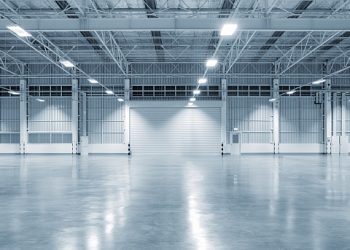 Factory building or warehouse building with concrete floor for industry background.